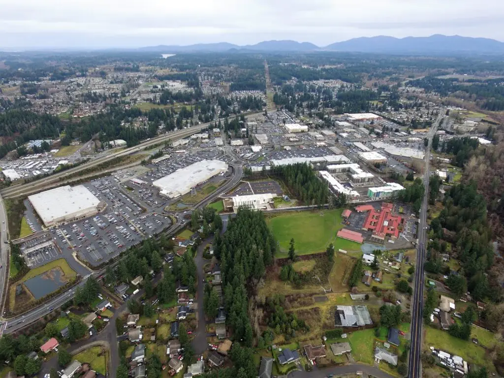 Covington General Contractor: Aerial view of Covington, WA, showcasing residential areas, commercial buildings, and surrounding natural landscapes, illustrating the diverse community we serve.