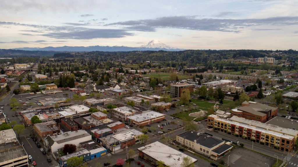 Aerial view of the downtown area and neighborhoods where our expert Puyallup Flooring Contractor works
